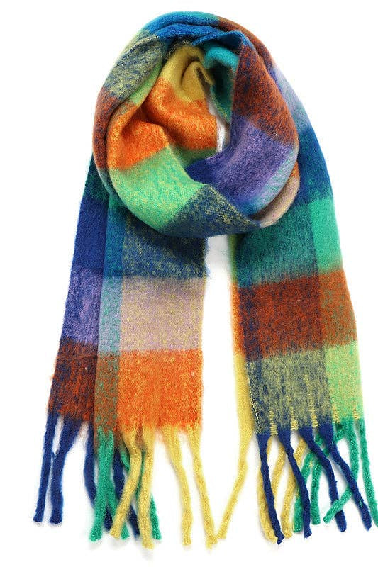 A multicolor plaid scarf with fringed ends, featuring blocks of blue, green, orange, purple, and yellow on a white background.